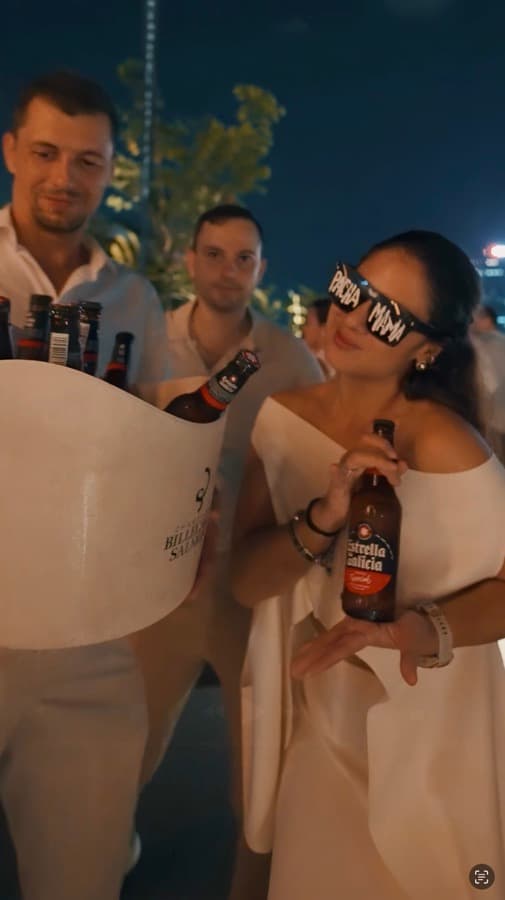 Guest wearing Pachamama sunglasses holding an Estrella Galicia beer